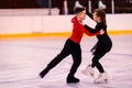 Children-athletes learn pair figure skating. dance elements