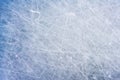 Ice background with marks from skating and hockey, blue texture of rink surface with scratches Royalty Free Stock Photo