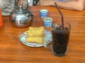 Ice black coffee and deep fried dough stick Royalty Free Stock Photo