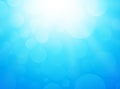 Ice blue background with bokeh and rays Royalty Free Stock Photo