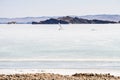 Ice boating competitions in the winter on lake Baikal in clear weather in mountains and sculpture from snow in the form of a table Royalty Free Stock Photo