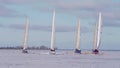 Ice boats compete on the ice of the Bay on a winter Sunny day.