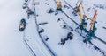 Ice bound frozen port for transshipment of coal from polar mines Container cargo ship loading North Arctic doc, top Royalty Free Stock Photo