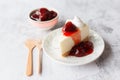 Ice box cheese cake with strawberry jam and whipping cream on white background Royalty Free Stock Photo