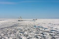 Ice breaker assist general cargo ship in ice navigation Royalty Free Stock Photo