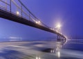 Ice is broken. Footbridge in winter city.