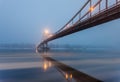 Ice is broken. Footbridge in winter city.