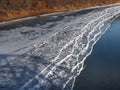 Ice Buildup On Shore Of River In Autumn