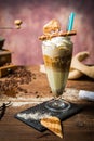 Ice caffe in a glass cup on a wooden table.