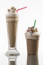 Ice caffe in glass and plastic takeaway cup, decorated Royalty Free Stock Photo