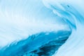 Ice canyon through a glacier in remote Alaska. Melting glacier river cuts through the surface creating overhanging ice Royalty Free Stock Photo