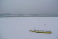 Ice capured yellow boat on frozen Danube river Royalty Free Stock Photo