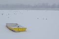 Ice capured yellow boat on frozen Danube river Royalty Free Stock Photo