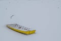 Ice capured yellow boat on frozen Danube river Royalty Free Stock Photo