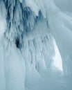 Ice cave interior with icicles and soft light. Royalty Free Stock Photo