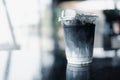 Ice charcoal latte with fresh milk it showing the texture and refreshing look of the drink