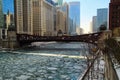 An ice chunk covered, frozen Chicago River is aqua blue and runs through Chicago Loop Royalty Free Stock Photo