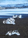 Ice Chunks Scattered on Black Sand at Diamond Beach in Iceland Royalty Free Stock Photo