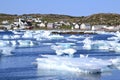 Ice chunks in Twillingate Bay with colourful homes