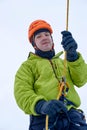 Ice climber belay with a rope and click up. hands close up