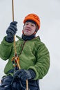 Ice climber belay with a rope and click up. hands close up