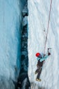 Ice climber deep inside a crevasse on the Matanuska Glacier, Alaska