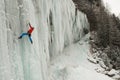 Ice climber on a frozen waterfall Royalty Free Stock Photo