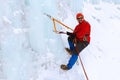 Ice climber on a frozen waterfall