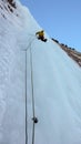 Ice climber on the headwall of the Throne icefall in the Avers Valley