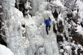 Ice climber on the frozen Boyana Waterfall in Vitosha Mountain near Sofia City, Bulgaria Royalty Free Stock Photo