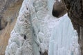 Ice climbing competition. Climbers climb an ice cliff Royalty Free Stock Photo
