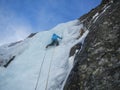 Ice climbing on a frozen icefall