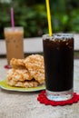 Ice coffee americano with Rice Cracker (Khao Tan) Royalty Free Stock Photo