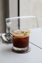 Ice coffee Espresso Tonic soda water with lime juice with sliced lemon on white table. Cold brew. Royalty Free Stock Photo