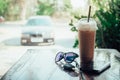 Ice coffee Key smart phone and  glasses in cafe Royalty Free Stock Photo