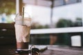 Ice coffee , Key and smartphone in cafe Royalty Free Stock Photo