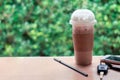 Ice coffee , Key and smartphone in cafe Royalty Free Stock Photo