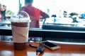 Ice coffee , Keys  and smartphone in cafe Royalty Free Stock Photo