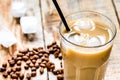 Ice coffee with milk and beans for lunch on wooden background Royalty Free Stock Photo