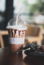 Ice coffee in a plastic glass with men wallet, phone and key car Royalty Free Stock Photo