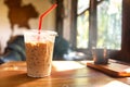 Ice coffee on wooden table at cafe windows morning Royalty Free Stock Photo