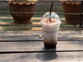 Ice coffee on a wooden table. Cold drink