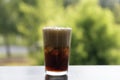 Ice cola with splashing CO bubbles. Drink with ice, closeup, fizzing, fizz. Royalty Free Stock Photo