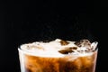 Ice cola with splashing CO bubbles in a glass Royalty Free Stock Photo