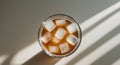 Ice Cold Brew. A Refreshing TopDown View of Iced Coffee with Geometric Shadows Royalty Free Stock Photo