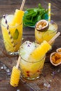 Ice cold cocktail with fresh passion fruit Royalty Free Stock Photo