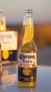 Ice cold corona beer bottle lid by the sunset golden hour light at Thomas Carter Lookout near Exmouth, Western Australia.