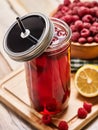 Ice cold drink glass with raspberry and lemon cocktail . Royalty Free Stock Photo