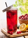 Ice cold drink glass with raspberry and lemon cocktail . Royalty Free Stock Photo