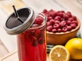 Ice cold drink glass with raspberry and lemon cocktail . Royalty Free Stock Photo